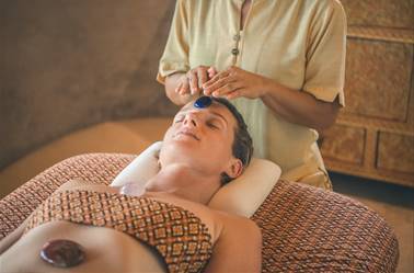 Person getting hot stone treatment