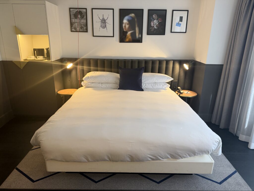 King bed shown straight-on with floor space on both sides.