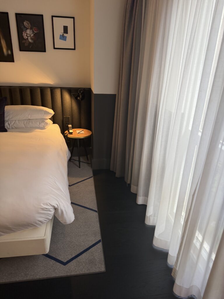 Accessible bedroom showing floor space at foot of bed and to window side.